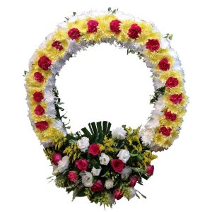 Floral arrangement of white blooms in a circular shape, a heartfelt sympathy wreath for a loved one
