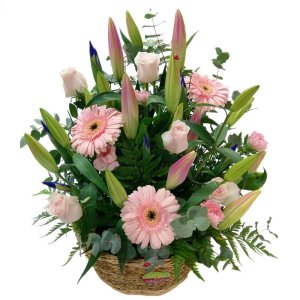A beautiful flower arrangement in a wicker basket