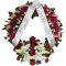 Beautiful sympathy wreath featuring ribbon and flowers