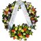 A sympathy wreath adorned with delicate flowers and a ribbon, symbolizing condolences and remembrance