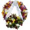 Floral sympathy wreath with delicate flowers and elegant ribbons