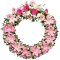 A sympathy wreath with pink and white flowers