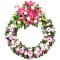 A sympathy wreath adorned with pink and white flowers