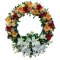 Colorful flower and greenery wreath on white backdrop