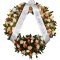 White background with a sympathy wreath adorned with flowers and ribbon
