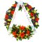 A sympathy wreath adorned with flowers and a ribbon, symbolizing condolences and remembrance