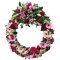 A sympathy wreath adorned with delicate pink and white flowers, conveying heartfelt condolences