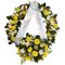 A sympathy wreath adorned with yellow flowers and delicate white ribbons