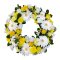 A sympathy wreath adorned with yellow and white flowers, creating a beautiful and comforting display