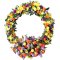 Floral sympathy wreath with a mix of colorful flowers and green leaves